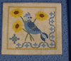 A Bluebird’s Sunflower Serenade