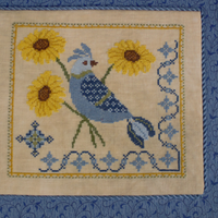 A Bluebird’s Sunflower Serenade